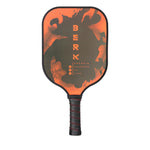 The Berk Calafia paddle in Fire colorway. The logo is in bright red and it has bright red flames around the edge of the face. The Calafia is a premium pickleball paddle with a solid polyvinl core and rough textured graphite face. The solid core design give the athlete increased power along with a consistant feel around the net. 